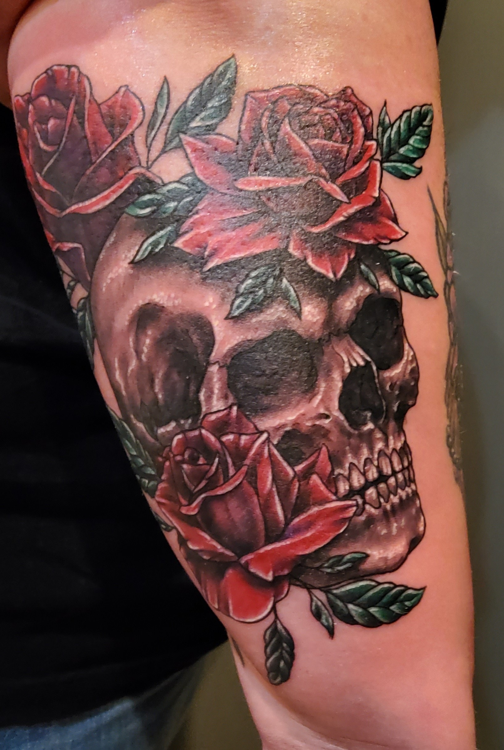 Custom floral skull tattoo with roses